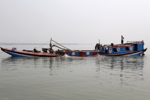 loaded sand transporters on the Jamuna River near Char Khamar Baspatari